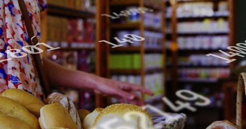 Consumer selecting fresh bread at local bakery