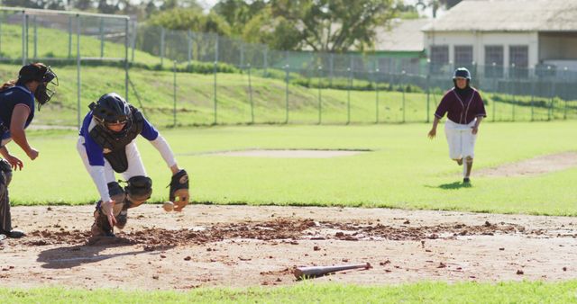 Baseball Players Competing During Game with Catcher Gathering Ball - Download Free Stock Images Pikwizard.com