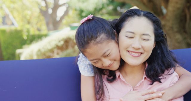 Mother and Daughter Hugging Outdoors with Happy Smiles - Download Free Stock Images Pikwizard.com