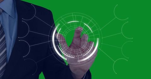 Executive tapping circular holographic interface on green screen for technology presentation