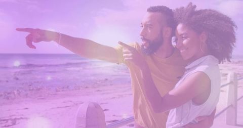 Happy couple enjoying scenic views on sunny coastal boardwalk