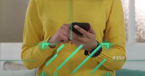 Woman holding smartphone tapping screen wearing smartwatch with green holographic ar interface