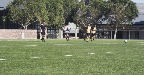 Diverse Soccer Team Playing Intense Match Outdoors