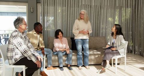 Diverse Group Engaging in Lively Counseling Session with Confidence