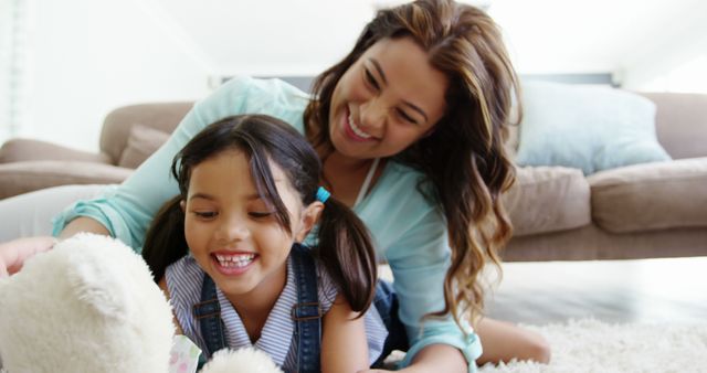 Mother and Daughter Playing Together in Living Room - Download Free Stock Images Pikwizard.com