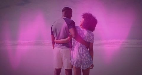 Couple Embracing at Ocean with Pink Heart Overlays