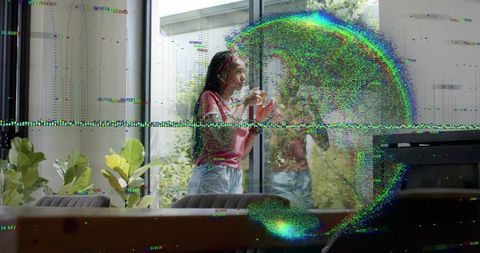 Woman holding glass touching sliding door while digital glitch distortion overlays home