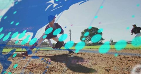 Baseball player fielding ground ball on base path action shot