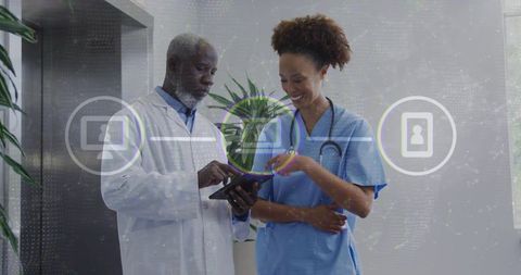 Reviewing digital patient data doctor and nurse collaborating with tablet overlays