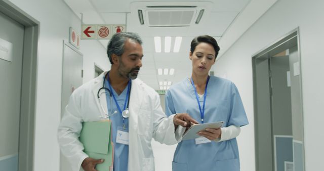 Doctors Collaborating in Modern Hospital Corridor - Download Free Stock Images Pikwizard.com