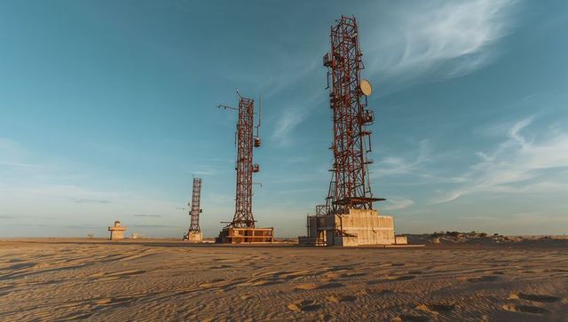 Telecommunication towers in arid desert landscape