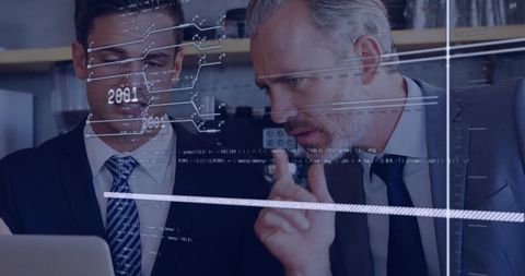 Professionals Analyzing Data Overlay on Laptop in Corporate Office