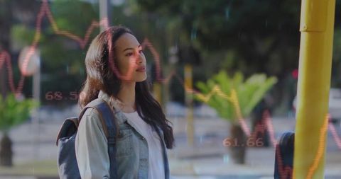 Woman Analyzing Digital Data on Urban Street