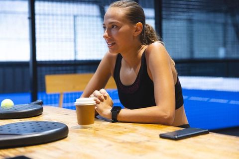 Athlete Relaxing with Coffee After Padel Game
