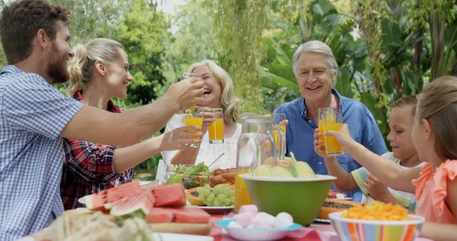 Happy Multi-Generational Family Enjoying Garden Picnic - Download Free Stock Images Pikwizard.com