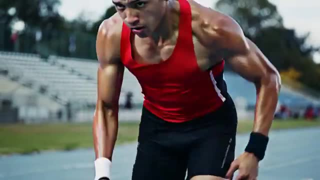 Focused Sprinter Charging the Track with Determination and Speed