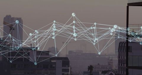 Network nodes connecting urban rooftops and cranes, visualizing smart city connectivity