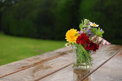 Rustic Bouquet in Glass Jar on Wooden Table