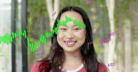 Smiling young woman with finance data overlays wearing red top outdoor analytics headshot