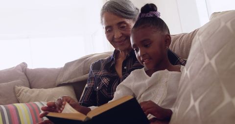 Grandmother Sharing Precious Reading Moments with Grandchild - Download Free Stock Images Pikwizard.com
