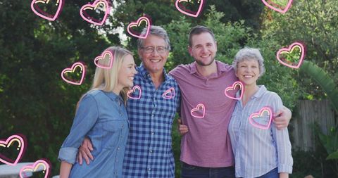 Happy Caucasian Family Bonding in Lush Green Garden with Heart Graphics - Download Free Stock Images Pikwizard.com