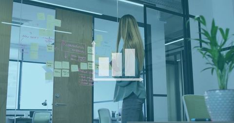 Businesswoman visualizing data insights in modern office setting