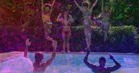 Friends Celebrating by Pool with Festive Lights at Night