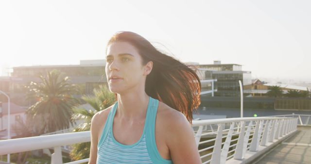 Young Woman Jogging on Urban Bridge - Download Free Stock Images Pikwizard.com