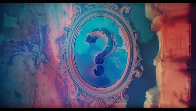 Ornate frame displaying mysterious question mark