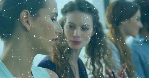 Modern Professionals Collaborating on Data-Driven Project in Office