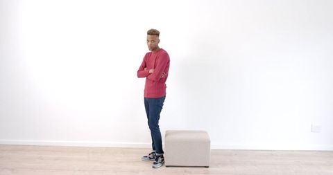 Man Standing with Arms Crossed in Minimalist Interior - Download Free Stock Images Pikwizard.com