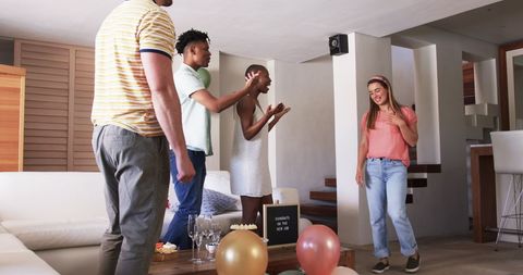 Friends Celebrating at Home for a New Job