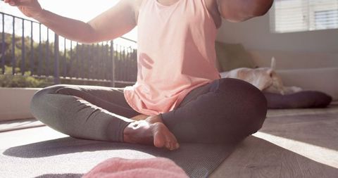 Senior African American Woman Practicing Yoga at Home