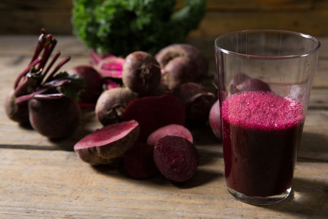 Close-up of beetroot and beetroot juice on wooden table
