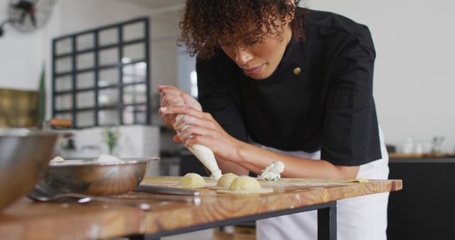 African American Female Chef Preparing Gourmet Dumplings in Modern Kitchen - Download Free Stock Images Pikwizard.com