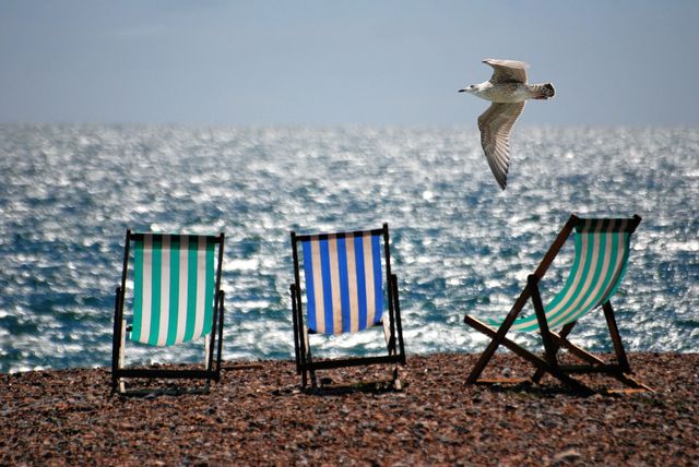 3 Green and Blue Beach Chairs on Brown Sea Shore - Download Free Stock Photos Pikwizard.com