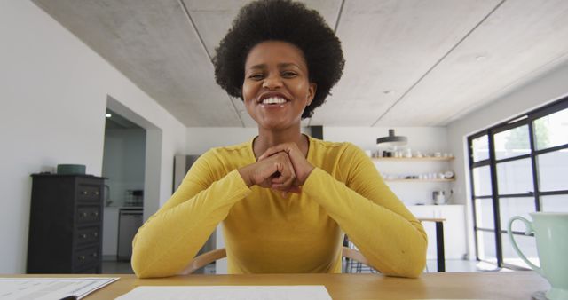 Confident African American Woman Smiling while Working at Home - Download Free Stock Images Pikwizard.com