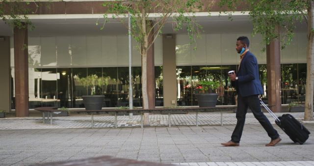 Businessman Walking with Luggage in Urban Environment - Download Free Stock Images Pikwizard.com