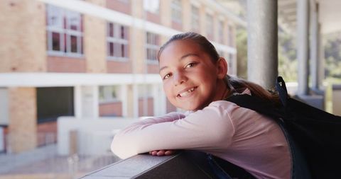 Smiling Student Relaxing During School Break on School Balcony - Download Free Stock Images Pikwizard.com
