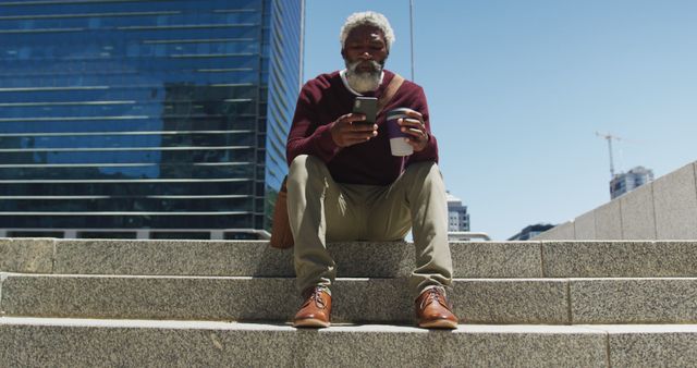 Senior Man Relaxing on Steps Using Smartphone and Drinking Coffee - Download Free Stock Images Pikwizard.com