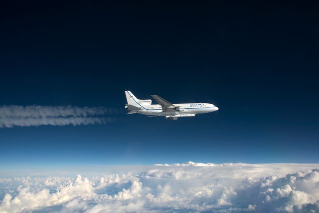 Photographed from the F-18 pathfinder aircraft, the Orbital ATK L-1011 Stargazer aircraft is seen flying over the Atlantic Ocean offshore from Daytona Beach, Florida. Attached beneath the aircraft is the Pegasus XL rocket with eight Cyclone Global Navigation Satellite System, or CYGNSS, spacecraft. The CYGNSS satellites will make frequent and accurate measurements of ocean surface winds throughout the life cycle of tropical storms and hurricanes. The data that CYGNSS provides will enable scientists to probe key air-sea interaction processes that take place near the core of storms, which are rapidly changing and play a crucial role in the beginning and intensification of hurricanes.  NOTE: The Dec. 12, 2016 launch attempt was postponed due to a hydraulic pump aboard the Orbital ATK L-1011 aircraft which is required to release the latches holding Pegasus in place, is not receiving power.