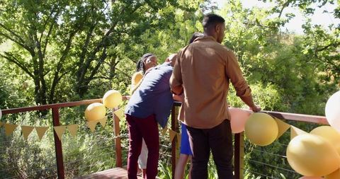 Joyful engagement celebration on scenic terrace