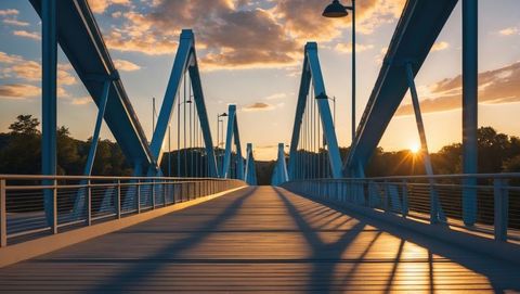 Pedestrian bridge with steel arches at sunset, knoxville concept