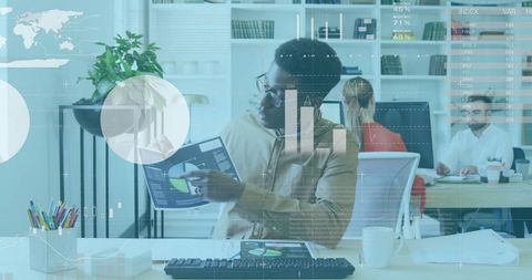 Businessman Analyzing Financial Data with Graphical Interface