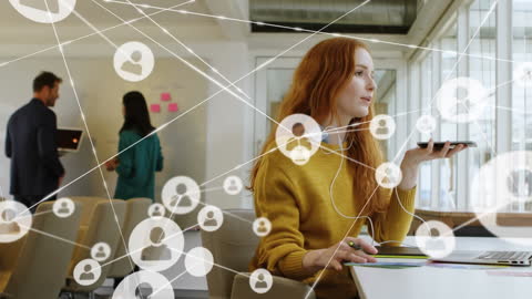 Businesswoman Networking Through Smartphone Technology in Modern Office