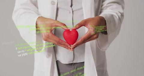 Doctor Holding Heart Highlighting Medical Innovation