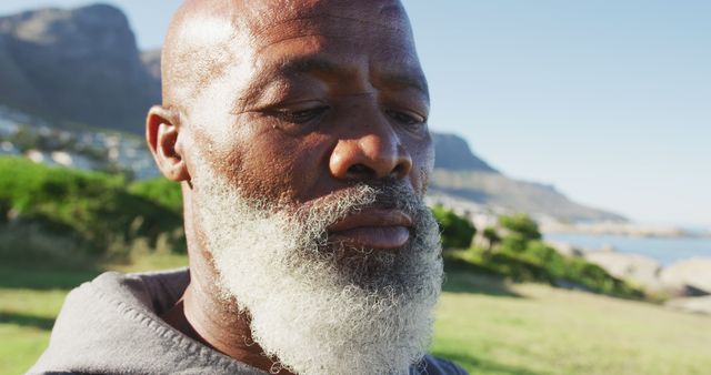 Senior African American Man Preparing for Exercise Outdoors in Nature - Download Free Stock Images Pikwizard.com