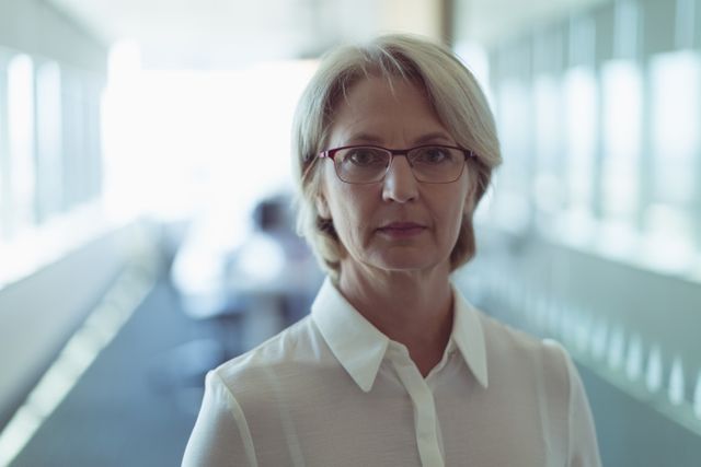 Portrait of mature businesswoman standing in office