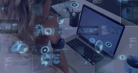 Woman Leaning Over Laptop Wearing Smartwatch Viewing Augmented Reality Data Dashboards