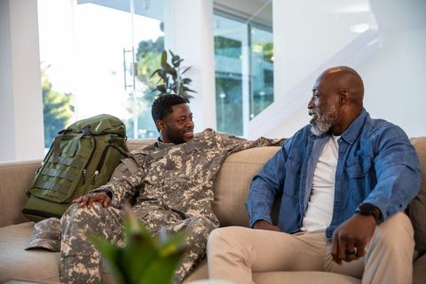 Father and Son Bonding at Home with Military Connection